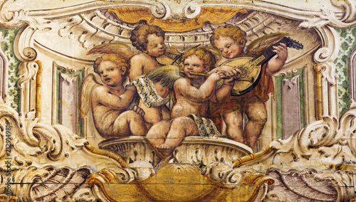 PARMA, ITALY - APRIL 15, 2018: The fresco of the choir of angels with the music instruments in church Chiesa di Santa Cristina by Filippo Maria Galletti (1636 - 1714).