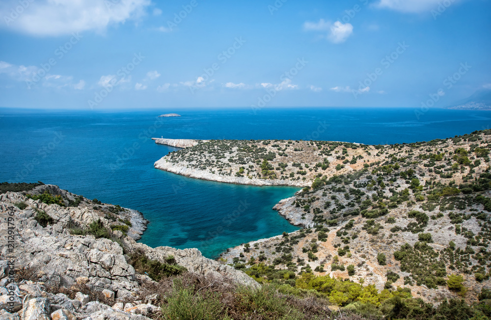 Beautiful calm bay with pine trees and blue clear sea at warm sunny summer day. Mediterranean sea, Turkey.