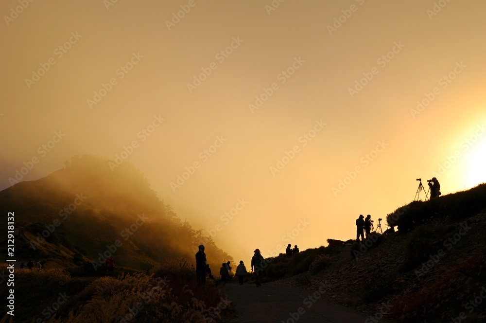   Silhouette of photographers at sunset in Hehuan Mountain, Nantou, Taiwan