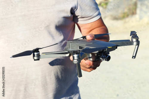 Dron in the hands of man