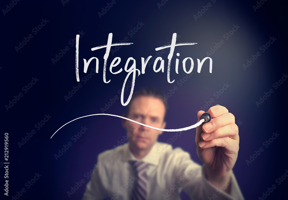 A businessman writing a integration concept with a white pen on a clear screen. A businessman writing a integration concept with a white pen on a clear screen.