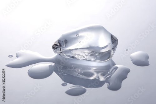 ice cubes melting on white background with copy space