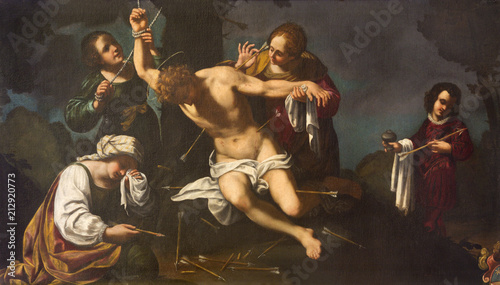 MODENA, ITALY - APRIL 14, 2018: The painting martyrdom of St. Sebastian in church Chiesa di Santa Maria della Pomposa by Bernardino Cervi from 17. cent. photo