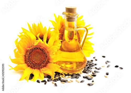 Sunflower oil with flowers and by seed on white background