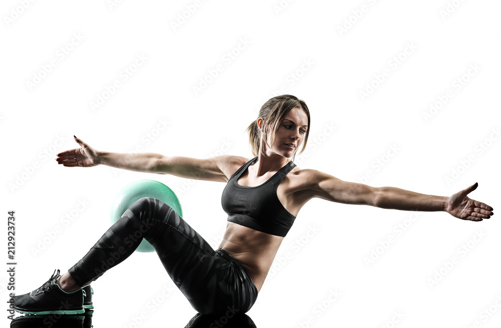 Obraz premium one caucasian woman exercising pilates fitness soft ball exercises isolated silhouette on white background