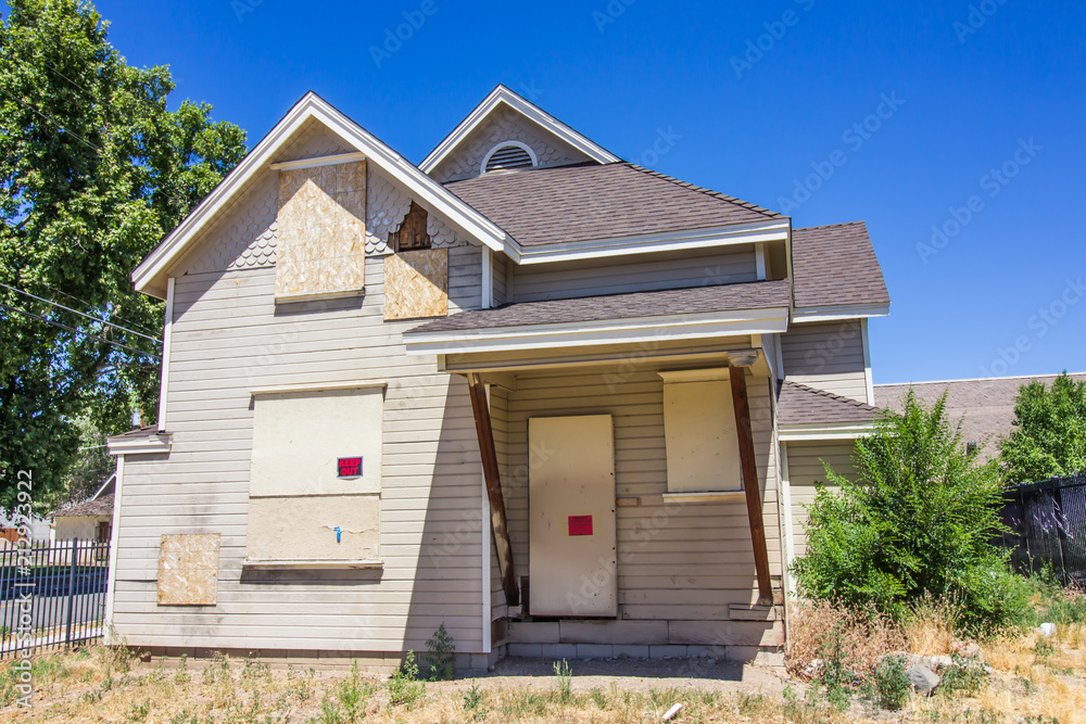 Abandoned Home With Boarded Up Windows & Doors Abandoned Home With Boarded Up Windows & Doors