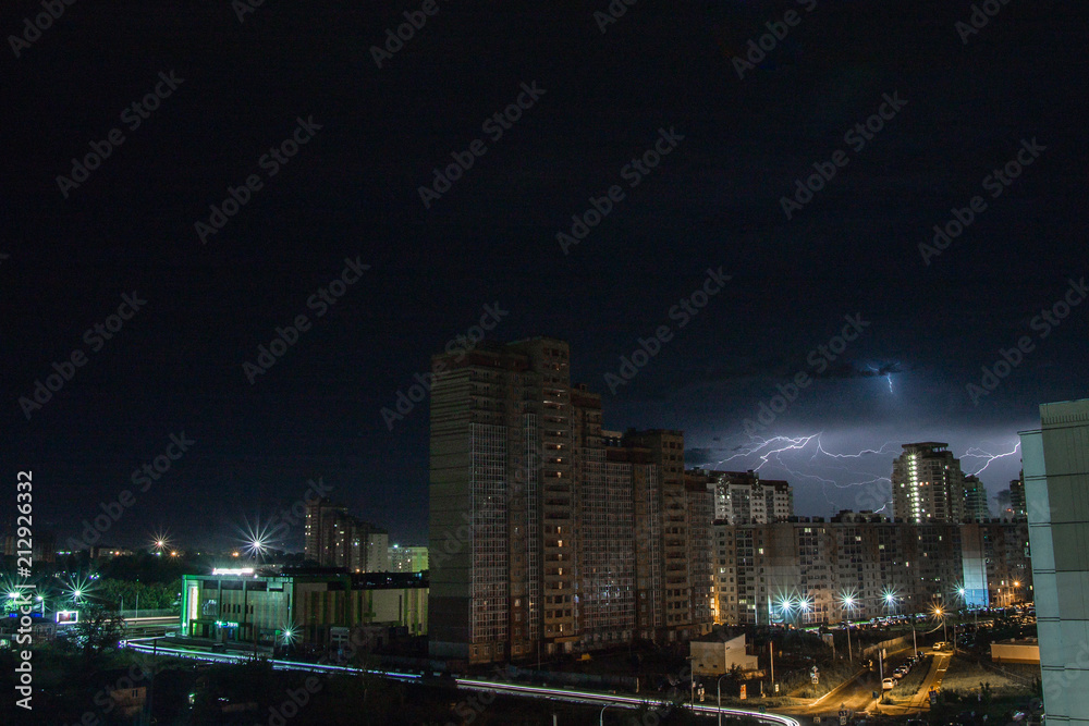 Fototapeta premium lightning over the city at night