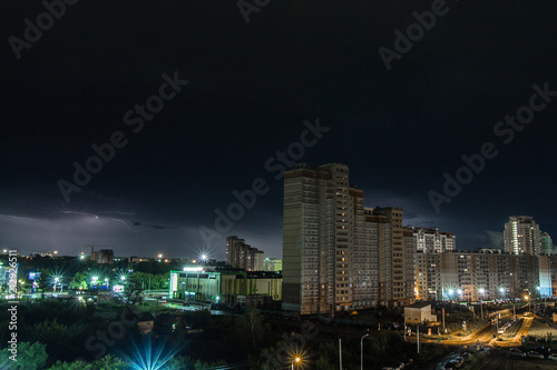 lightning over the city at night © kapichka