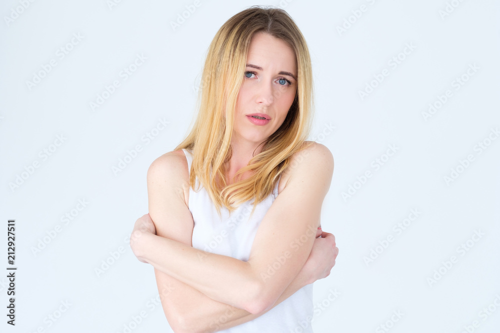 emotion face. downhearted depressed rueful frustrated sad woman. young beautiful blond girl portrait on white background. emotion face. downhearted depressed rueful frustrated sad woman. young beautiful blond girl portrait on white background.
