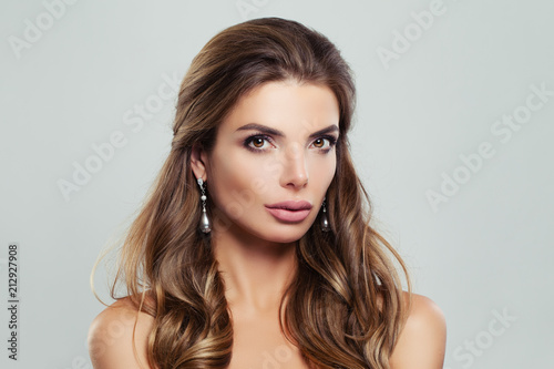 Perfect Woman with Wavy Brown Hair and Pearls Earrings, Fashion Beauty Portrait