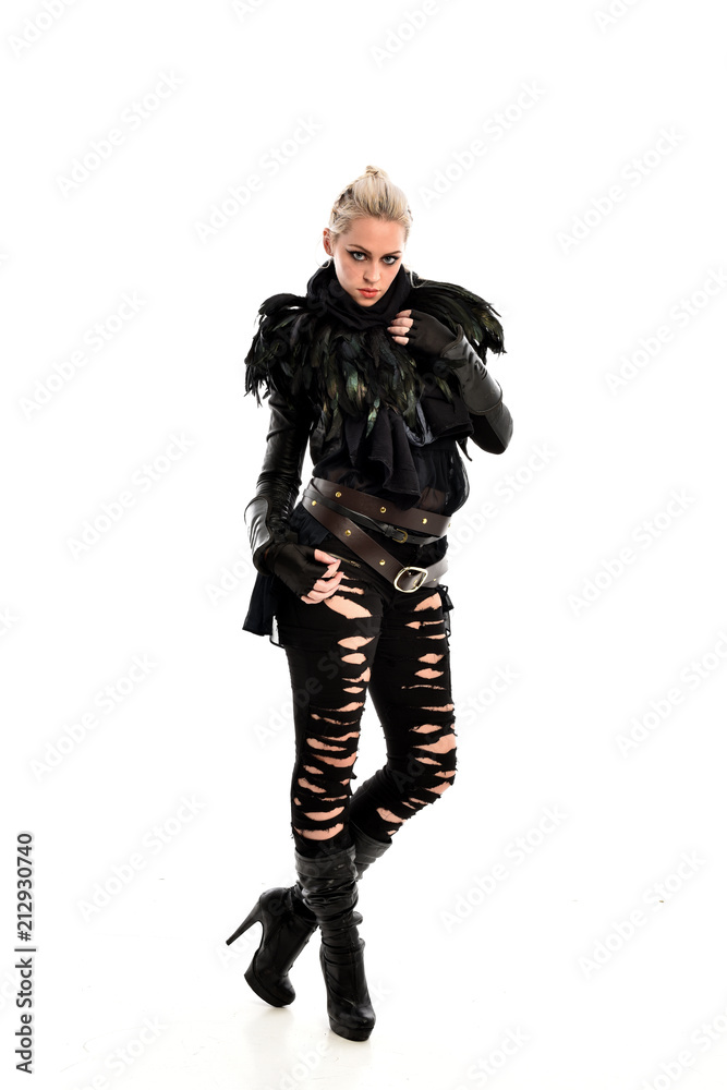 full length portrait of blonde girl wearing torn black feather costume. standing pose, isolated on white background. full length portrait of blonde girl wearing torn black feather costume. standing pose, isolated on white background.