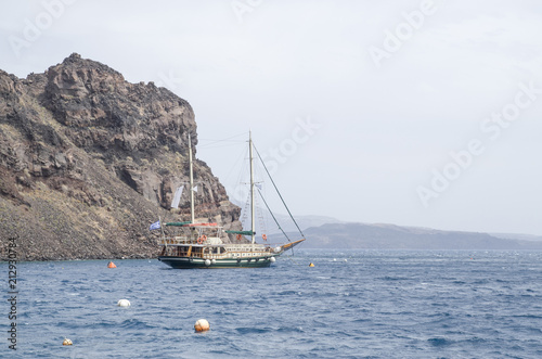 Wooden ship for trip near island Terasia and Santorini