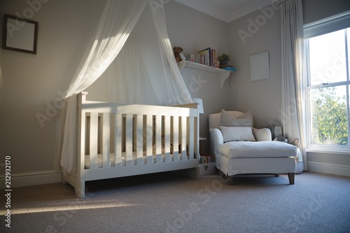 Wooden cradle at home photo