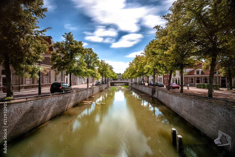 View over the city canal in the historic center of the Dutch hanseatic town of Kampen in the province of Overijssel. View over the city canal in the historic center of the Dutch hanseatic town of Kampen in the province of Overijssel.