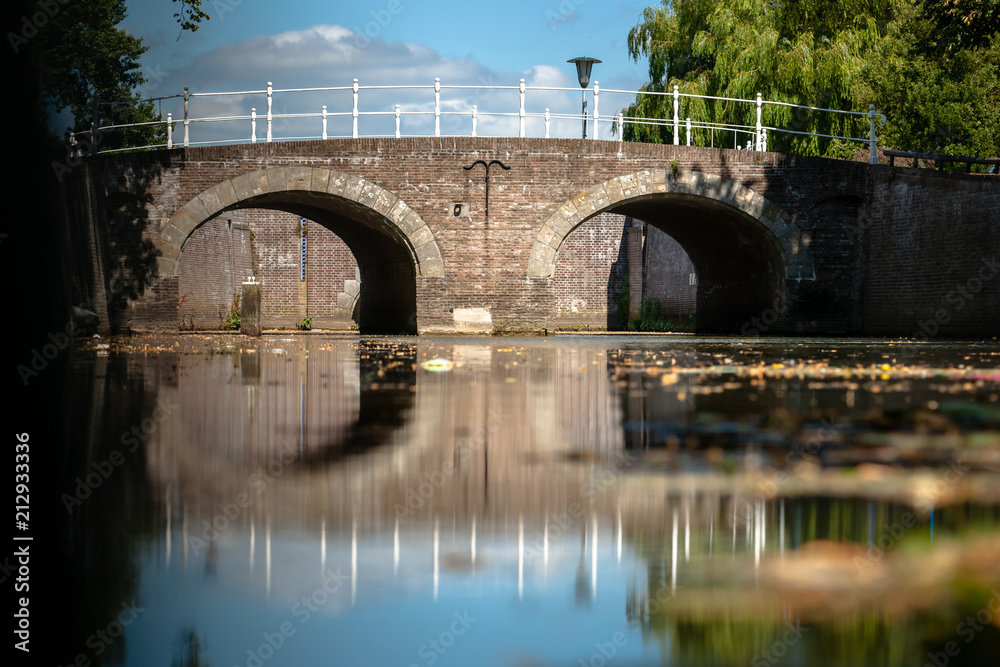 Fototapeta premium Old fortifications and city canal in a medieval city.