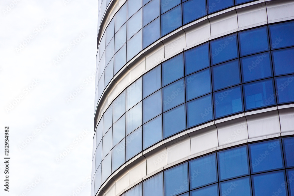 Reflexion of blue sky with clouds in building windows. Reflexion of blue sky with clouds in building windows.