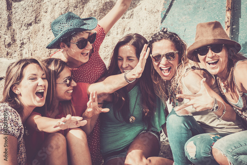 Fotografie group of crazy nice beautiful caucasian girls outdoor under the summer sun doing a party all together