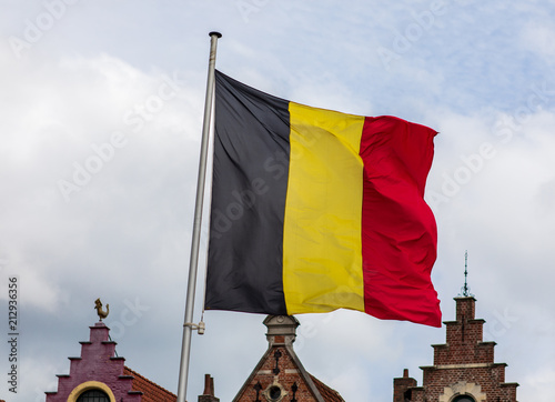 Belgian flag and vintage rootops in Brugge photo