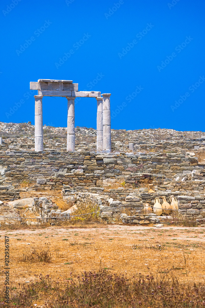 Fototapeta premium Ancient ruins in the island of Delos in Cyclades, one of the most important mythological, historical and archaeological sites in Greece.
