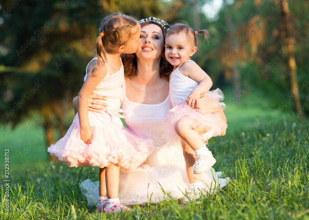 Fototapeta premium mom and two daughters