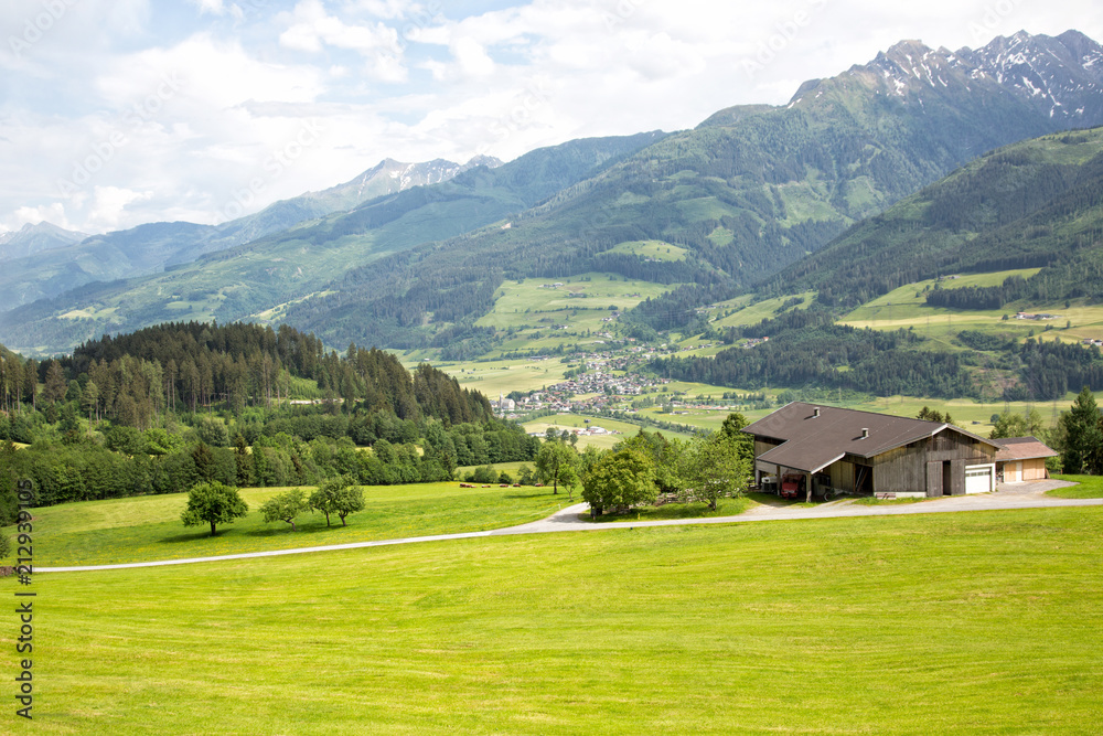 Beautiful lush green Austrian alp valley meadows landscape and hiking trails in the Zell am See area.