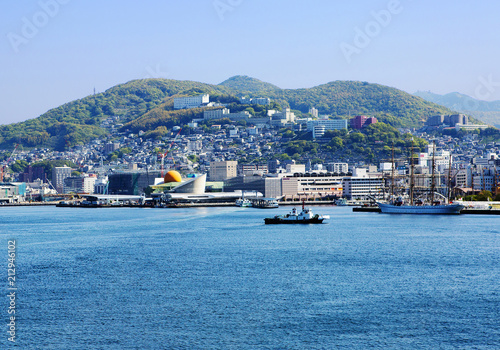 Japan, Nagasaki Port. Nagasaki is the Central city in Japan. Nagasaki is a natural Harbor surrounded by green hills — one of the most beautiful in the world.