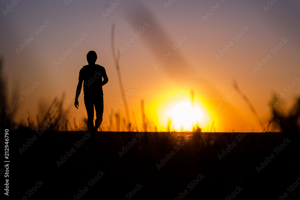 Man walking at sunset