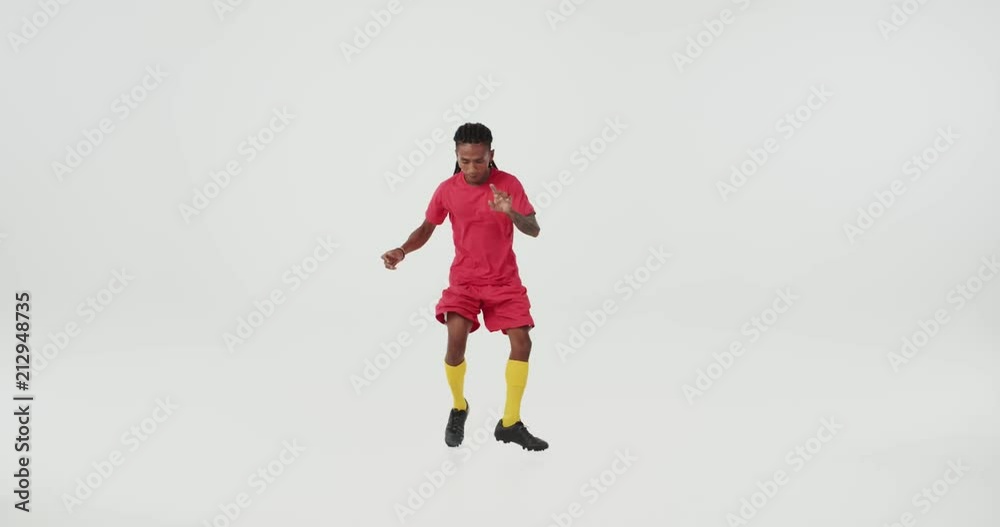 Brazilian football player in red uniform dancing. Brazilian football player in red uniform dancing.