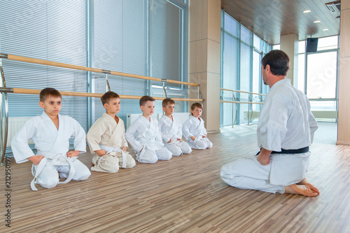young, beautiful, successful multi ethical kids in karate position photo