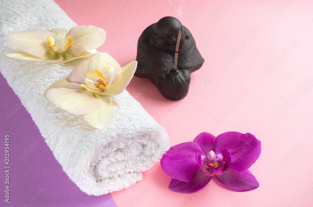 Beautiful soap in the form of flowers and towel with lavender flowers for Spa treatments on a two-tone background. Selective focus. Beautiful soap in the form of flowers and towel with lavender flowers for Spa treatments on a two-tone background. Selective focus.