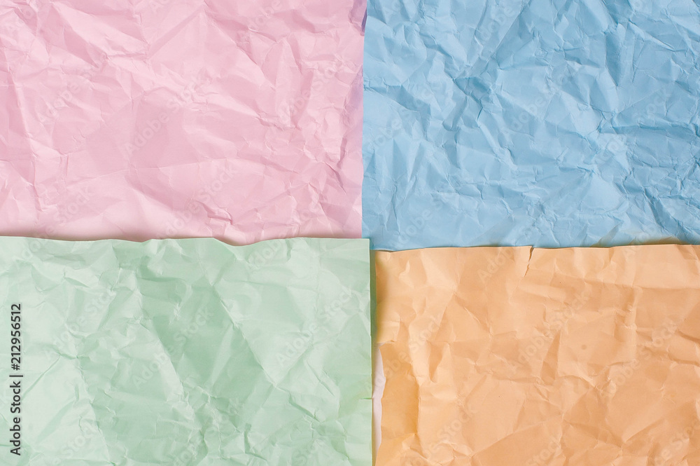 Obraz premium Blue pink orange green crumpled background paper texture
