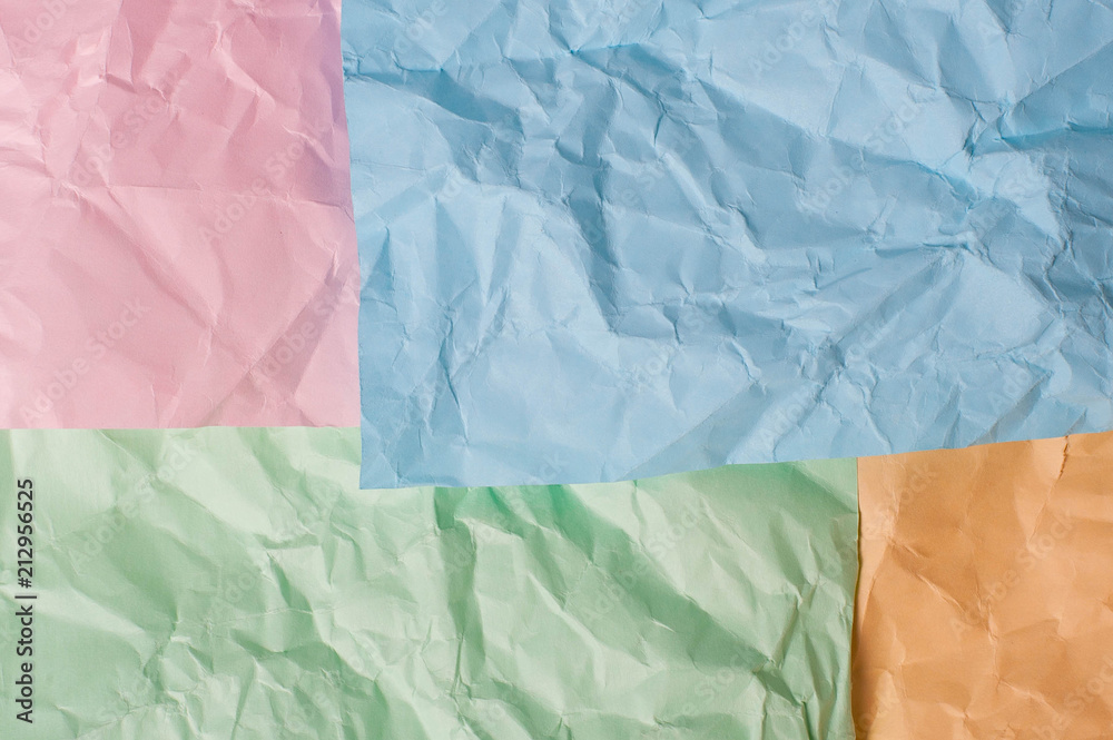 Obraz premium Blue pink orange green crumpled background paper texture