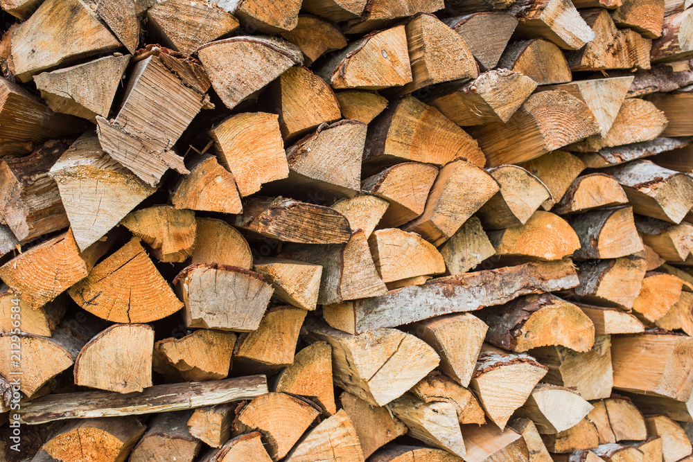The texture of a large stack of firewood The texture of a large stack of firewood