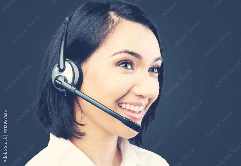 Woman call center operator on dark background Woman call center operator on dark background