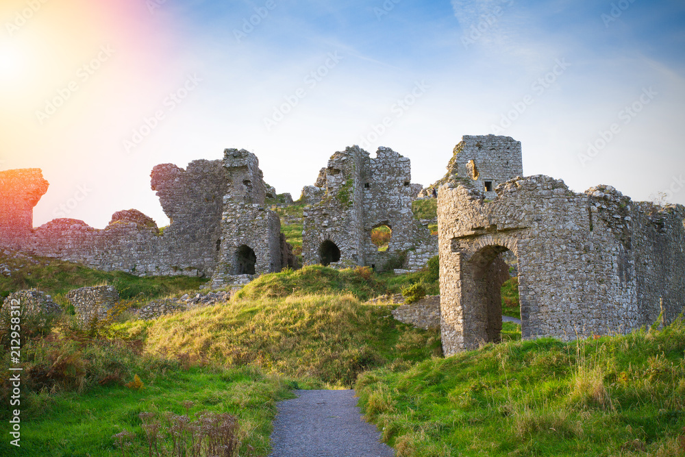 Countryside landscape with ruined castle, hills and sky. Stradbally, County Laois, Ireland