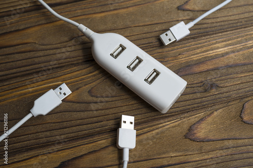 three wires are connected to the USB port of the hub. The concept of data exchange, charging, connection, connectors.