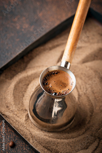 Traditional turkish coffee in cezve photo