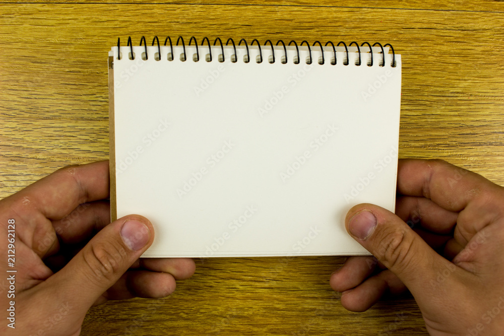 Obraz premium White notepad on a table. Empty space for text. School and education concept