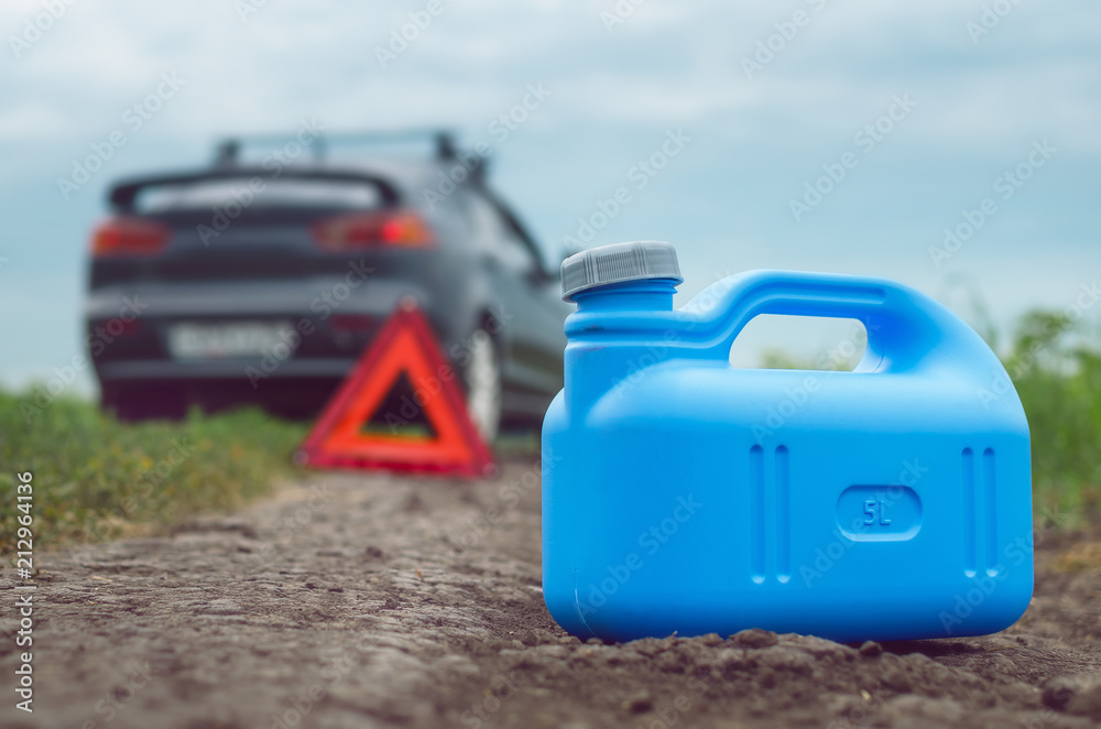 Gasoline finished concept. Not enough fuel. Red emergency triangle stop