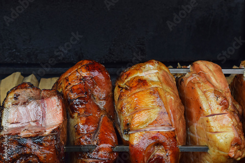 Photography Close up pork meat roasted on open wood fire
