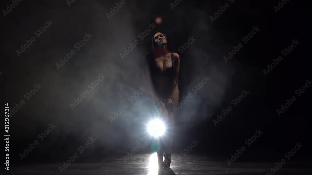 Stripper in the smoke dancing . Black smoke background. Silhouette. Slow motion Stripper in the smoke dancing . Black smoke background. Silhouette. Slow motion