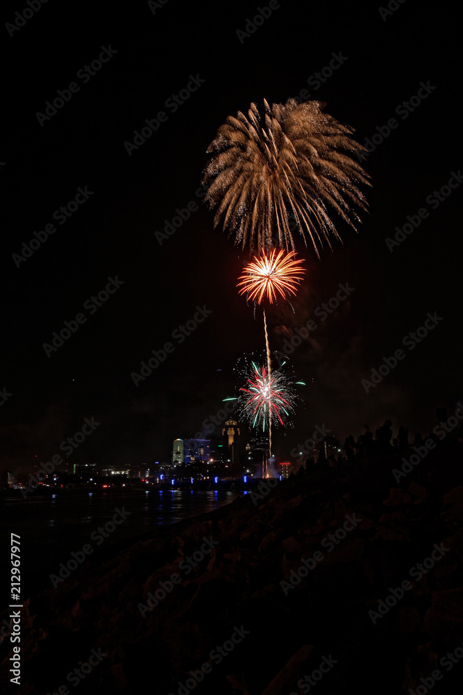 Fireworks explode over the Des Moines skyline. The Financial Center and EMC buildings are lit up for the Independence Day holiday. Fireworks explode over the Des Moines skyline. The Financial Center and EMC buildings are lit up for the Independence Day holiday.