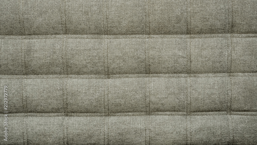 Fototapeta premium Coach type cloth matting screed tightened with buttons. Natural chesterfield style quilted upholstery backdrop close up. background texture