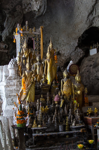 Buddha statues in the lower Pak Ou Cave besides the Mekong river 25km upstream of Luang Prabang