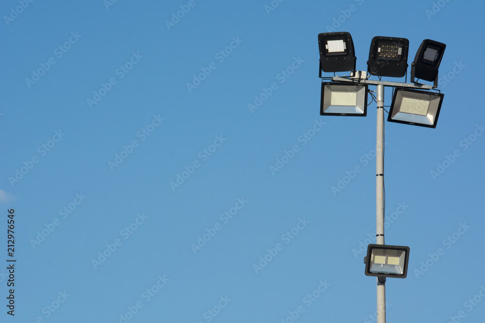 Horizontal View of Stadium Illunimators on Blue Sky Background Horizontal View of Stadium Illunimators on Blue Sky Background