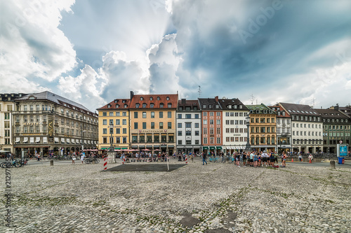 Munich, Germany June 09, 2018: Old houses in the city of Munich at the Residenzstrasse, Germany. People walk through the streets of Munich.