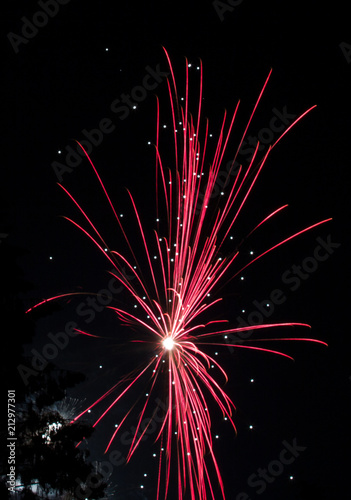 Straight up Red Fourth of July Fireworks on Lake Sawyer in Washington State