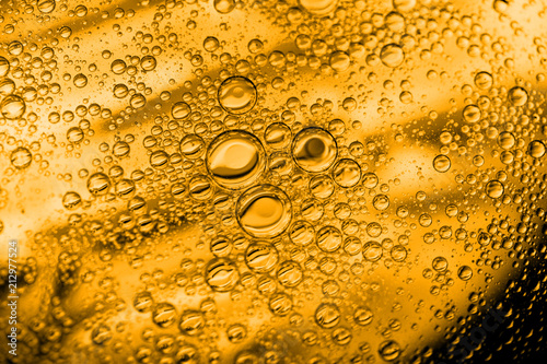 beer goldish oil textures and sparkles macro photo