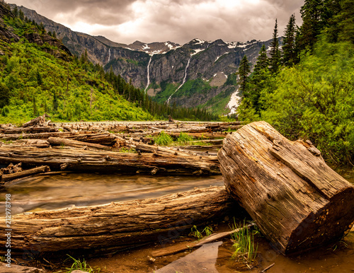 A panoramic view of Bearhat and Little Matterhorn Mountains dominate the view from the shores of Avalanche Lake. photo