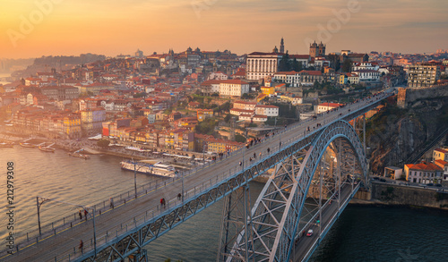 Porto panoramic aerial view of Dom Luis Bridge at sunset. Porto, Portugal. Cityscape of Porto downtown touristic Ribeira